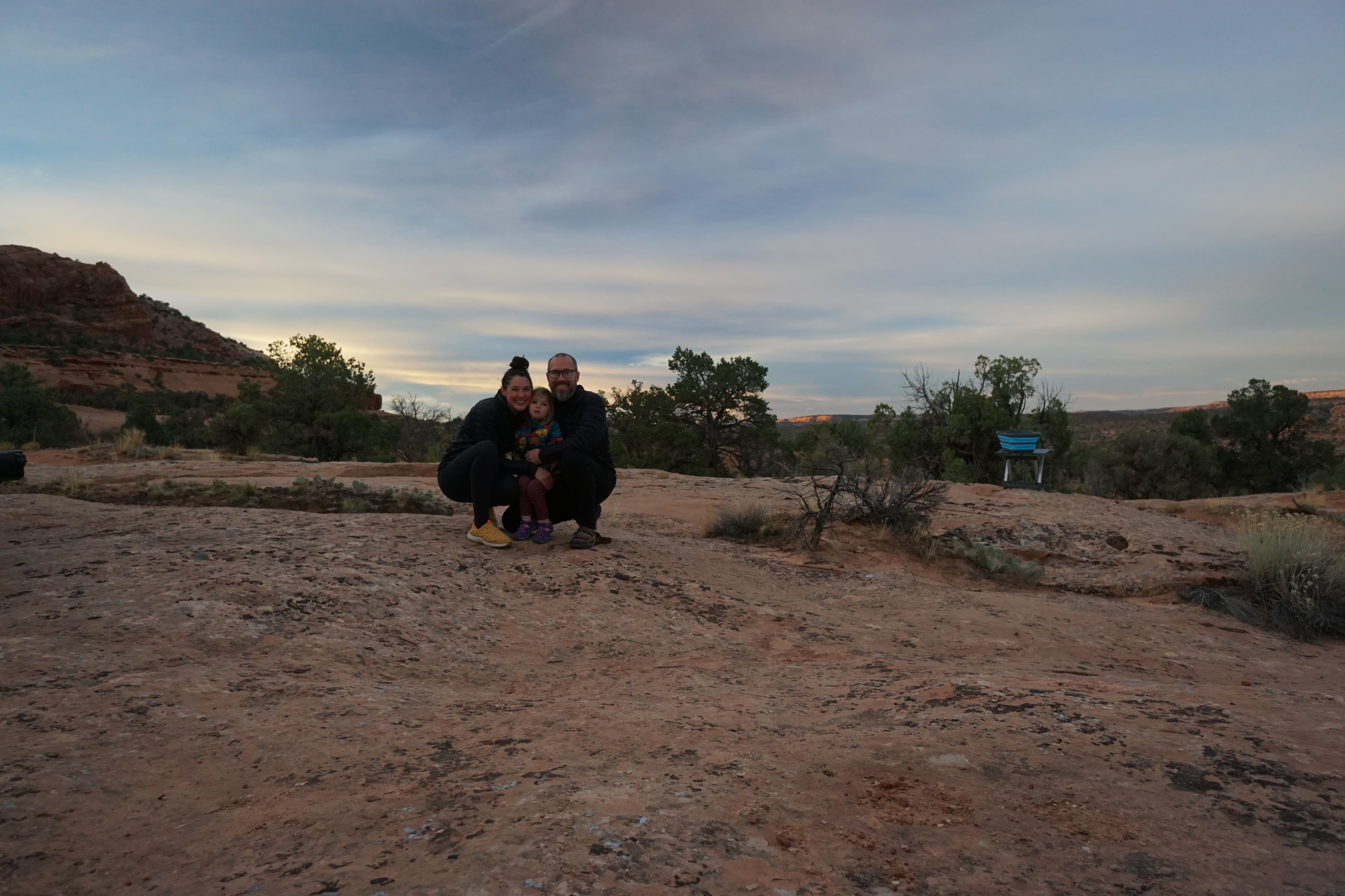 Chloe, Brenton, and Lydia on southern Utah red rock at dusk